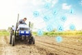 Futuristic innovative technology pictogram and a farmer on a tractor. Science of agronomy. Technology Improvement in quality and Royalty Free Stock Photo