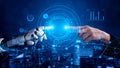 Futuristic Interaction Between Human Hand and Robot Hand with Digital Interface and Data Visualization in Background Royalty Free Stock Photo