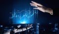 Futuristic Interaction Between Human Hand and Robotic Arm Demonstrating Chart Analysis and Data Visualization in Stock Royalty Free Stock Photo