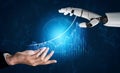 Futuristic Interaction Between Human Hand and Robotic Arm Symbolizing Technology and Collaboration in Data Analysis and Royalty Free Stock Photo