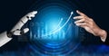 Futuristic Interaction Between Human Hand and Robotic Hand in a Digital Environment with Graphs and Data Visualizations Royalty Free Stock Photo
