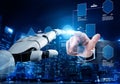 Futuristic Interaction Between Human Hand and Robotic Hand in a Digital Environment Showcasing Technology and Innovation Royalty Free Stock Photo