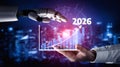 Futuristic Interaction Between Human Hand and Robotic Hand with Rising Graph Indicating Growth from 2023 to 2026 in a Royalty Free Stock Photo
