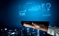 Futuristic Interface of Data Analysis and Visualization with Tablet Over City Skyline at Night, Technology Concept for Royalty Free Stock Photo
