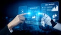 Futuristic Interface of Human Hand Interacting with Robotic Hand Displaying Marketing Data and Chart Analysis in a High Royalty Free Stock Photo