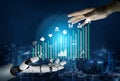 Futuristic Interface of Human Hand and Robot Hand Interacting with Digital Charts and Graphs Representing Growth and Royalty Free Stock Photo