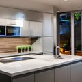 A futuristic kitchen with high-gloss white cabinets, LED lighting, and state-of-the-art appliances1, Generative AI