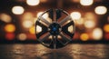 Futuristic metallic wheel with sleek, segmented spokes stands on a reflective
