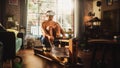 Futuristic Metaverse Home Gym: Strong Athletic Black Man Exercising on Rowing Machine Wearing Royalty Free Stock Photo