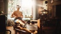 Futuristic Metaverse Home Gym: Strong Athletic Black Man Exercising on Rowing Machine Wearing Royalty Free Stock Photo