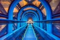 Modern tunnel escalator with traveler at Umeda Sky Building Royalty Free Stock Photo