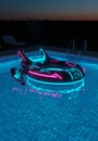 Futuristic Neon Boat in a Nighttime Pool Royalty Free Stock Photo