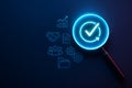 Futuristic Neon Magnifying Glass with Business Icons and Validation Checkmark Royalty Free Stock Photo