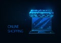 Futuristic online shopping concept with glowing low polygonal laptop