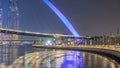 Futuristic Pedestrian Bridge over the Dubai Water Canal Illuminated at Night , UAE. Royalty Free Stock Photo