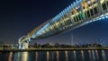 Futuristic Pedestrian Bridge over the Dubai Water Canal Illuminated at Night , UAE. Royalty Free Stock Photo