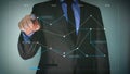 Futuristic portrait of a businessman uses a career chart, a hologram, a diagram, in a suit, makes a finger click. Concept: future,