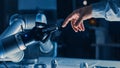 Futuristic Robot Arm Touches Human Hand in Humanity and Artificial Intelligence Unifying Gesture.