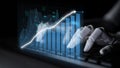 Futuristic Robot Hand Analyzing Data With Financial Charts and Graphs on a Dark Background, Representing Artificial Royalty Free Stock Photo