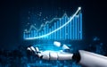 Futuristic Robot Hand Analyzing Digital Data Trends with Financial Graphs in a High-Tech Environment Impute Royalty Free Stock Photo