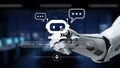 Futuristic Robot Hand Holding Chatbot Icon with Text Bubbles in Digital Environment for Technology and Communication Royalty Free Stock Photo