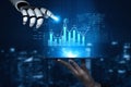 Futuristic Robot Hand Interacting with Data Visualization on Tablet Display, Symbolizing Artificial Intelligence and Royalty Free Stock Photo