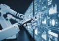 A futuristic robot hand interacting with a digital interface displaying complex data analytics Royalty Free Stock Photo