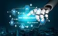 Futuristic Robot Hand Interacting with Digital Risk Management Icons and Interface Representing Security, Control Royalty Free Stock Photo
