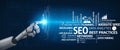 Futuristic Robot Hand Touching Digital Interface with SEO Concepts, Data Analytics, Planning Strategies, and Online Royalty Free Stock Photo