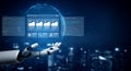 Futuristic Robot Hand Presenting Digital Interface with Data Visualizations and Floating Screens against a Night Royalty Free Stock Photo
