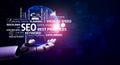 Futuristic Robot Hand Presenting SEO Concepts on Digital Background with Keywords for Online Marketing and Data Analysis Royalty Free Stock Photo