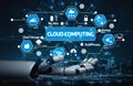 Futuristic Robot Hand Reaching Out Towards Cloud Computing Concept with Data Management Icons and Digital Graphics in Royalty Free Stock Photo