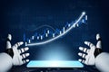 Futuristic Robot Hands Displaying Financial Growth Chart with Data Visualization and Smartphone on Dark Background Royalty Free Stock Photo