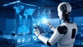 Futuristic robot interacting with digital interface, data visualization, and world map. Royalty Free Stock Photo