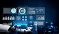 Futuristic robotic hand displaying digital data and analytics dashboard with charts, graphs, and global maps in a high Royalty Free Stock Photo