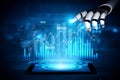 Futuristic robotic hand interacting with data visualization on tablet screen showcasing digital analytics and Royalty Free Stock Photo