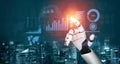 Futuristic Robotic Hand Interacting with Digital Data, Analytics and Global Metrics in High-Tech City Setting at Night Royalty Free Stock Photo