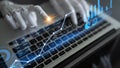 Futuristic robotic hand interacting with digital data analytics on laptop, showcasing advanced technology in finance and Royalty Free Stock Photo