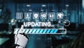 Futuristic robotic hand interacting with digital interface showing updating progress, technical icons, and modern office Royalty Free Stock Photo