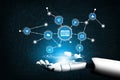 Futuristic Robotic Hand Interacting with Digital Network Icons Representing Advertising, Communication, and Data Royalty Free Stock Photo