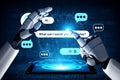 Futuristic robotic hand reaching out towards a digital interface displaying chat bubbles and greetings, symbolizing Royalty Free Stock Photo