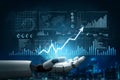 Futuristic robotic hand presenting data visualization with graphs, charts, and analytics symbols in a digital finance Royalty Free Stock Photo
