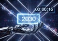 Futuristic robotic hand presents glowing 2030 digital display with countdown timer Royalty Free Stock Photo
