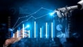Futuristic robotic hand interacting with data visualization charts and graphs, symbolizing automation and technology in Royalty Free Stock Photo