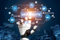 Futuristic robotic hand interacting with digital data analytics symbols, showcasing advanced technology, big data, and Royalty Free Stock Photo