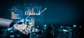 Advanced robotic hand presenting data visualization and analytics concepts with charts and graphs against a blurred city Royalty Free Stock Photo