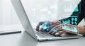 Futuristic robotic hand typing on a laptop with glowing digital interfaces and data visualization Royalty Free Stock Photo