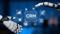 Futuristic robotic hands presenting digital CRM concept with icons symbolizing customer relationship management and Royalty Free Stock Photo