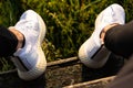 Futuristic shoes at a lost place in the nature. green background, Adidas shoes Alphaedge 4D