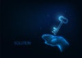 Futuristic smart solution, business success concept with glowing hand holding a key on dark blue Royalty Free Stock Photo